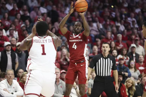 Arkansas guard Davonte Davis (4) looks to shoot a 3-point basket during the first half of an NCAA college basketball game against Oklahoma, Saturday, Dec. 9, 2023, in Tulsa, Okla. (AP Photo/Joey Johnson)
