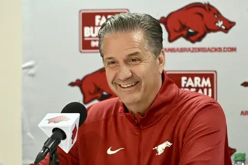 John Calipari answers questions from reporters during a press conference after being introduced as Arkansas's head head basketball coach Wednesday, April 10, 2024, in Fayetteville, Ark. (AP Photo/Michael Woods, File)