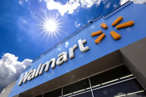 A Walmart sign is displayed over the entrance to a store on June 25, 2019 in Pittsburgh. Walmart is raising the starting base pay for store managers, while redesigning its bonus plan that will put more of an emphasis on profits for these leaders. The moves, announced Thursday, Jan. 18, 2024, will be effective Feb. 1. (AP Photo/Gene J. Puskar, File)