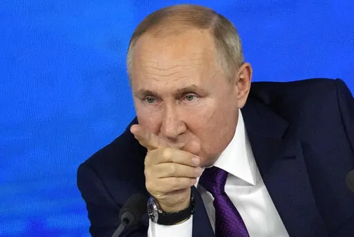 Russian President Vladimir Putin gestures while speaking during his annual news conference in Moscow, Russia, Thursday, Dec. 23, 2021. (AP Photo/Alexander Zemlianichenko)