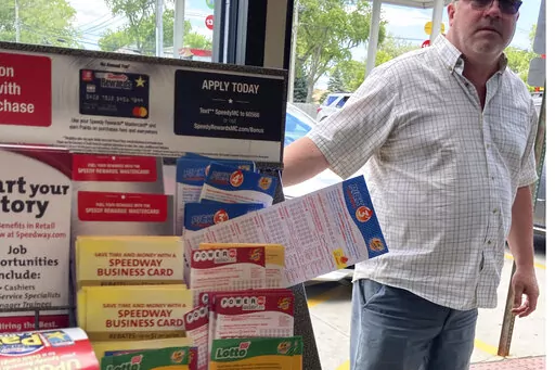 A customer walks in to the Speedway gas station in Des Plaines, Ill., where the winning Mega Millions lottery ticket was sold, Saturday, July 30, 2022.  Two people who wish to remain anonymous have claimed a $1.337 billion Mega Millions jackpot after a single ticket to the late July drawing was sold in the Chicago suburb, lottery officials said Wednesday, Sept. 21.(AP Photo/Nam Y. Huh)