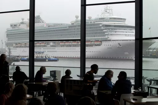 The Italian-built cruise ship MS Azura sails past the EYE film institute as it leaves the port of Amsterdam, Netherlands, Jan. 9, 2013. Amsterdam municipality wants to move a cruise liner terminal out of the heart of the historic capital as the latest step in its ongoing battle against pollution and hoards of tourists clogging its narrow, cobbled streets, it was announced Friday, July 21, 2023. The Dutch capital is one of the many picturesque European cities grappling with how to manage visitor 