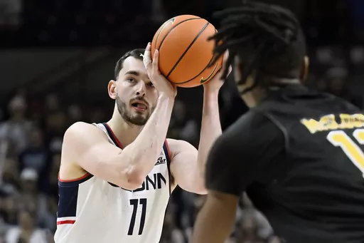 UConn forward Alex Karaban (11) shoots against Arkansas-Pine Bluff in the second half of an NCAA college basketball game, Saturday, Dec. 9, 2023, in Storrs, Conn. (AP Photo/Jessica Hill)