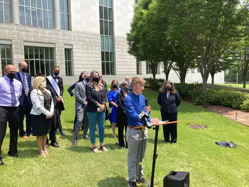 Dylan Brandt speaks at a news conference outside the federal courthouse in Little Rock, Ark., July 21, 2021. Brandt, a teenager, is among several transgender youth and families who are plaintiffs challenging a state law banning gender confirming care for trans minors. A psychiatrist called to the stand by Arkansas, as the state defends its ban on gender affirming care for children, said Monday, Nov. 28, 2022, that he was concerned about the impact the law could have on some transgender youth who