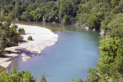 The Illinois River as seen from Goat's Bluffat the J.T. Nickel Family Nature and Wildlife Preserve, July 18, 2019. The world's largest poultry producer is among nearly a dozen poultry companies that face a March 17th deadline to reach agreement with the state of Oklahoma on how to clean a polluted watershed. A federal judge on Wednesday, Jan. 18, 2023 ruled that Arkansas-based Tyson Foods, Minnesota-based Cargill Inc. and others are responsible for pollution of the Illinois River Watershed by di