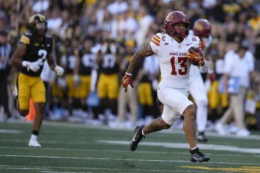 Iowa State wide receiver Jaylin Noel (13) scores on a 75-yard touchdown reception during the second half of an NCAA college football game against Iowa, Saturday, Sept. 7, 2024, in Iowa City, Iowa. Iowa State won 20-19. (AP Photo/Charlie Neibergall)