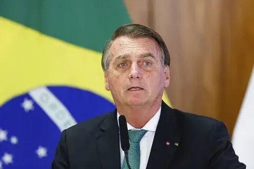 FILE - Brazil's President Jair Bolsonaro speaks during a joint press conference Paraguay's president at the Planalto Palace in Brasilia, Brazil, Nov. 24, 2021. Bolsonaro was taken to a Sao Paulo hospital early Monday, Jan. 3, 2022, with a suspected intestinal obstruction, the country’s media reported. (AP Photo/Raul Spinasse, File)