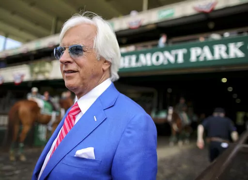 Trainer Bob Baffert walks out to the winner's circle after the Brooklyn Invitational Stakes horse race at Belmont Park, Saturday, June 9, 2018, in Elmont, N.Y. A retired New York State Supreme Court Justice has recommended a two-year suspension for trainer Bob Baffert after a New York Racing Association hearing. Judge O. Peter Sherwood, who served as the hearing officer for the case, released a report with his findings Wednesday, April 27, 2022, that will be sent to a three-member panel for cons