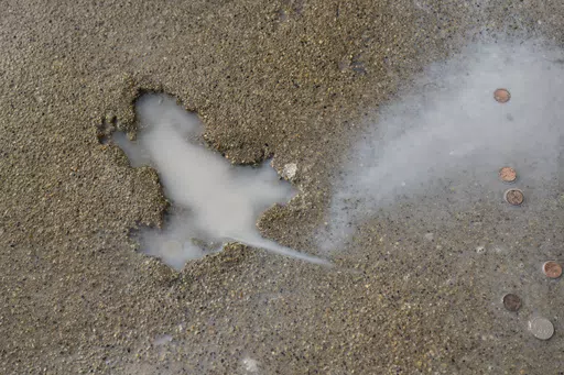 Chicago's iconic Rat Hole along the 1900 block of West Roscoe Street in the Roscoe Village neighborhood is seen, Jan. 19, 2024, in Chicago. The Chicago sidewalk landmark some residents affectionately called the “rat hole" was removed Wednesday, April 24, after city officials determined the section bearing the imprint of an animal was damaged and needed to be replaced, officials said. (Tyler Pasciak LaRiviere/Chicago Sun-Times via AP, File)