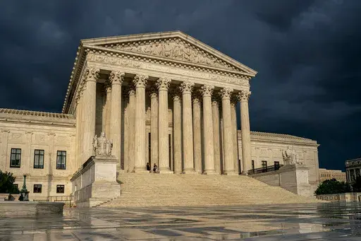 The Supreme Court is seen under stormy skies in Washington, June 20, 2019. In the coming days, the Supreme Court will confront a perfect storm mostly of its own making, a trio of decisions stemming directly from the Jan. 6, 2021 attack on the U.S. Capitol. (AP Photo/J. Scott Applewhite, File)