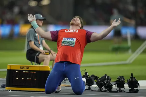 Ryan Crouser, of the United States, reacts after his final throw in the men's shot put final as he wins gold during the World Athletics Championships in Budapest, Hungary, Saturday, Aug. 19, 2023. Everything is trending in the right direction for the shot put world champion after being diagnosed with two blood clots in his left leg just before his win at the world championships last month. (AP Photo/Ashley Landis, File)