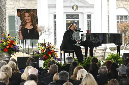Axl Rose performs during a memorial service for Lisa Marie Presley Sunday, Jan. 22, 2023, in Memphis, Tenn. She died Jan. 12 after being hospitalized for a medical emergency and was buried on the property next to her son Benjamin Keough, and near her father Elvis Presley and his two parents. (AP Photo/John Amis)