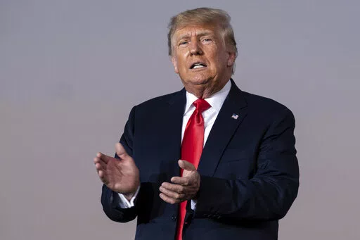 Former President Donald Trump prepares to take the stage during a rally in Perry, Ga., on Sept. 25, 2021.  The New York attorney general’s office says its civil investigation has uncovered evidence that Trump's company used “fraudulent or misleading” asset valuations to get loans and tax benefits. In a court filing late Tuesday, Jan. 18, 2022, Attorney General Letitia James’ office said evidence showed that the Trump Organization routinely misrepresented the value of its properties and g