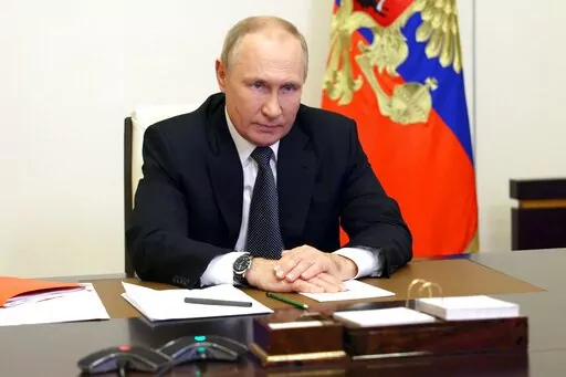 Russian President Vladimir Putin chairs a Security Council meeting via videoconference at the Novo-Ogaryovo residence outside Moscow, Russia, Wednesday, Oct. 19, 2022. (Sergei Ilyin, Sputnik, Kremlin Pool Photo via AP)