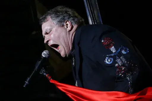 Singer Meat Loaf performs in support of Republican presidential candidate and former Massachusetts Gov. Mitt Romney at the football stadium at Defiance High School in Defiance, Ohio, Thursday, Oct. 25, 2012. Meat Loaf, whose "Bat Out Of Hell" album is one of the all time bestsellers, has died, family said on Facebook, Friday, Jan. 21, 2022. (AP Photo/Charles Dharapak, File)