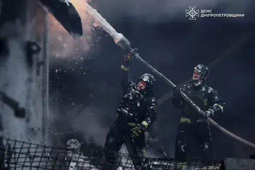 In this image provided by the Ukrainian Emergency Service, firefighters put out a fire following a Russian missile attack on the country's energy system in Dnipropetrovsk region, Ukraine, Dec. 25, 2024. (Ukrainian Emergency Service via AP, File)