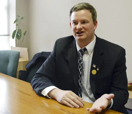 South Dakota Attorney General Jason Ravnsborg speaks in Sioux Falls, S.D. on Feb. 23, 2014. A South Dakota House committee investigating whether the state's attorney general should be impeached for his conduct surrounding a 2020 fatal car crash is set to finish its work this week. House lawmakers are wrapping up a monthslong investigation that has splintered the state's Republicans over the fate of Ravnsborg. (AP Photo/Dirk Lammers, File)