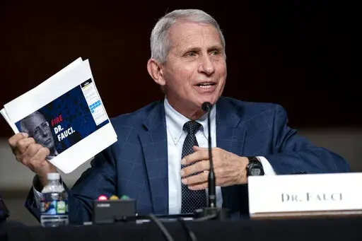 Dr. Anthony Fauci, director of the National Institute of Allergy and Infectious Diseases and chief medical adviser to the president, speaks during a Senate Health, Education, Labor, and Pensions Committee hearing Tuesday, Jan. 11, 2022 on Capitol Hill in Washington. Speaking Tuesday night, April 26, 2022, on PBS’ “NewsHour,” Fauci said the global pandemic isn’t over but the U.S. currently is “out of the pandemic phase.” But it doesn’t mean the coronavirus threat to Americans has en
