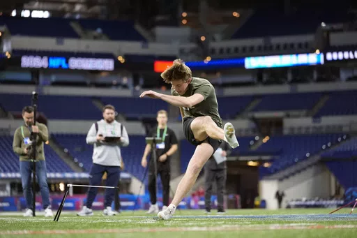 Arkansas kicker Cameron Little runs a drill at the NFL football scouting combine, Sunday, March 3, 2024, in Indianapolis. The Jacksonville Jaguars are now counting on the youngest kicker ever drafted, Cam Little of Arkansas, to stop a revolving door and bring stability to a position that has been one of the league’s most tumultuous over the last four years. (AP Photo/Michael Conroy, File)
