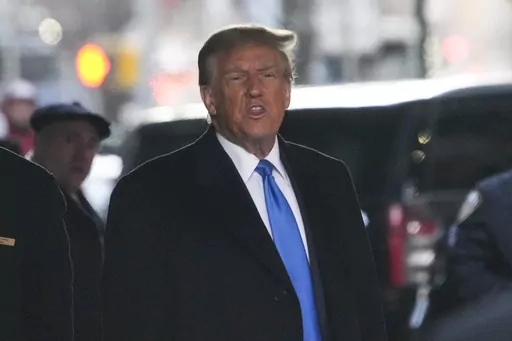 Former President Donald Trump leaves his apartment building in New York, Monday, Jan. 22, 2024. On Friday, Jan. 26, The Associated Press reported on stories circulating online incorrectly claiming a judge on Monday delayed proceedings in Trump’s New York defamation trial until Tuesday, the day of the New Hampshire primary, which is proof of election interference. (AP Photo/Seth Wenig, File)