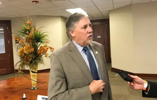 In this Feb. 1, 2021, file photo, Rep. Mark Lowery speaks to reporters at the Arkansas state Capitol in Little Rock, Ark. Lowery said he's dropping out of the race for secretary of state. (AP Photo/Andrew DeMillo, File)