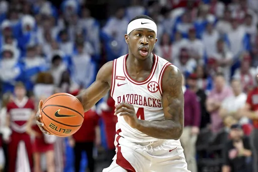 Arkansas guard Davonte Davis (4) against Kentucky during the first half of an NCAA college basketball game on Feb. 26, 2022, in Fayetteville, Ark. The Razorbacks open at home against North Dakota State on Nov. 7. (AP Photo/Michael Woods, File)