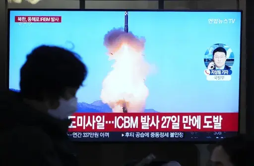 A TV screen shows a file image of North Korea's missile launch during a news program at the Seoul Railway Station in Seoul, South Korea, Sunday, Jan. 14, 2024. North Korea fired a ballistic missile toward the sea on Sunday, its neighbors said, in its first missile launch this year, as the North is expected to further raise regional animosities in an election year for its rivals South Korea and the United States. (AP Photo/Ahn Young-joon)