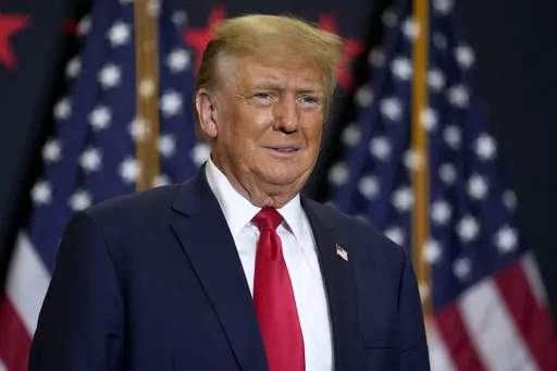 Former President Donald Trump speaks during a commit to caucus rally, Dec. 19, 2023, in Waterloo, Iowa. Police said Tuesday, Dec. 26, 2023, they are investigating incidents directed at Colorado Supreme Court justices and providing extra patrols around their homes in Denver following the court's decision to remove Trump from the state's presidential primary ballot. (AP Photo/Charlie Neibergall, File)