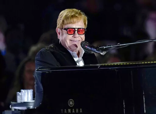 Elton John performs on the South Lawn of the White House in Washington, Friday, Sept. 23, 2022. Elton John is scheduled to perform at the Glastonbury Festival in June, in what organizers say will be his last-ever show in Britain. The festival announced Friday, Dec. 2, 2022 that the star will play the 2023 festival’s final night on June 25 (AP Photo/Susan Walsh, File)