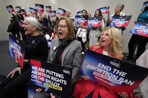 Missouri residents and pro-choice advocates react to a speaker during Missourians for Constitutionals Freedom kick-off petition drive, Feb. 6, 2024, in Kansas City, Mo. At least four states will have abortion-related ballot questions in November's election and there's a push to get them before voters in several others. (AP Photo/Ed Zurga, File)