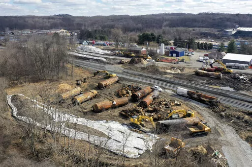A view of the scene Friday, Feb. 24, 2023, as the cleanup continues at the site of of a Norfolk Southern freight train derailment that happened on Feb. 3 in East Palestine, Ohio. (AP Photo/Matt Freed)