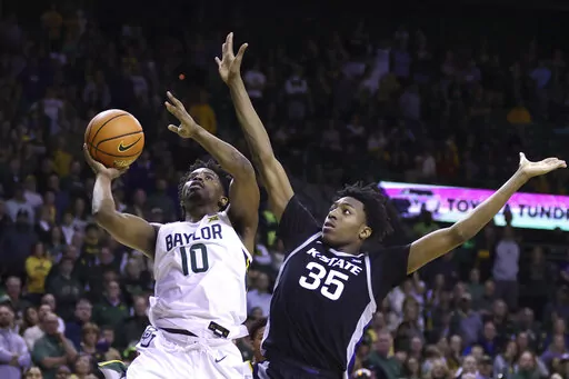 Baylor guard Adam Flagler (10) shoots over Kansas State forward Nae'Qwan Tomlin (35) in the second half of an NCAA college basketball game, Saturday, Jan. 7, 2023, in Waco, Texas. (AP Photo/Rod Aydelotte)
