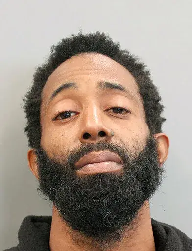 This booking photo provided by the Houston Police Department shows Tony Earls on Tuesday, Feb. 15, 2022. Houston police say Earls, who had been robbed at an ATM on Monday evening, Feb. 14, opened fire in an attempt to stop his attacker but instead shot a 9-year-old girl in a truck driving nearby. The girl later died at a hospital.  (Houston Police Department via AP)