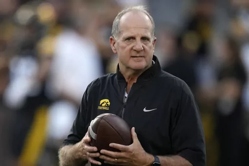 Iowa defensive coordinator Phil Parker walks on the field before an NCAA college football game against Michigan State, Saturday, Sept. 30, 2023, in Iowa City, Iowa. Parker has been named the recipient of the 2023 Broyles Award, presented annually to the top assistant coach in college football.(AP Photo/Charlie Neibergall, File)