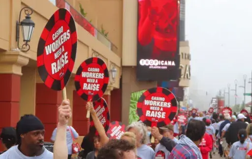 Union members picket outside the Tropicana casino in Atlantic City N.J. on June 1, 2022. The main casino workers union is threatening a strike against at least 5 casinos in July if new contracts are not reached by then, and on Wednesday,  June 22, the City Council of Atlantic City called on the casinos to avert a strike by paying workers more and hiring more of them. (AP Photo/Wayne Parry)