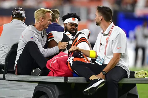 Cleveland Browns linebacker Chris Odom (61) is taken from the field after being injured during the second half of an NFL preseason football game against the Chicago Bears, Saturday, Aug. 27, 2022, in Cleveland. (AP Photo/David Dermer)