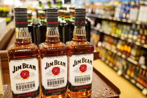 Shelves display bottles of bourbons for sale at a Pennsylvania fine wine and spirits store, Saturday, Jan. 22, 2022, in Harmony, Pa.  Despite ongoing challenges from the pandemic, American whiskey producers toasted another year of growth. Combined U.S. sales for bourbon, Tennessee whiskey and rye whiskey rose 6.7%, or $288 million, to $4.6 billion in 2021, the council said. Domestic volumes rose 4.5% to 29.7 million cases. (AP Photo/Keith Srakocic)