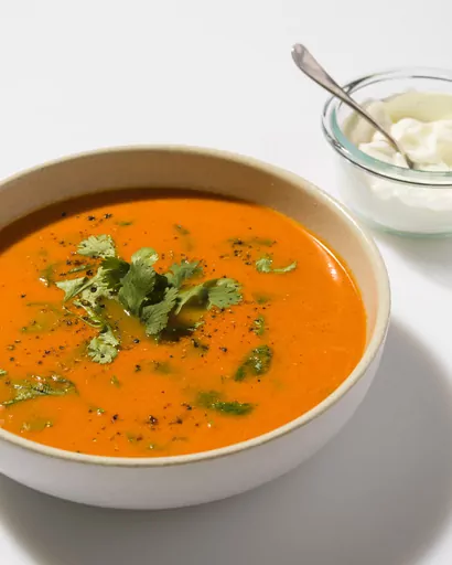 This image released by Milk Street shows a recipe for Indian-style tomato-ginger soup. (Milk Street via AP)