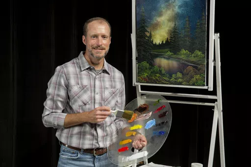 Nicholas Hankins appears in the studio during a taping of "The Joy of Painting with Nicholas Hankins: Bob Ross' Unfinished Season." (Derek Sanford/WDSC-TV via AP)
