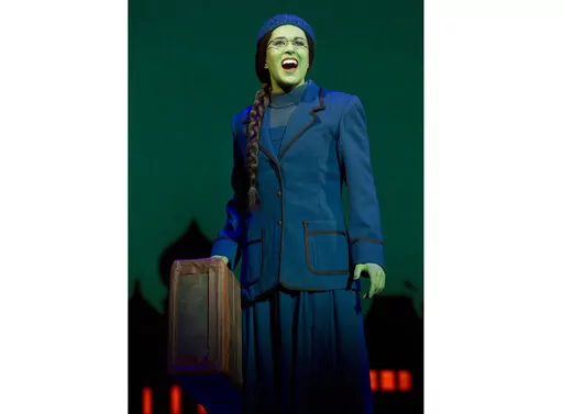 This image released by Polk & Co. shows understudy Carla Stickler in the role of Elphaba from the musical "Wicked" in New York in March 2012. Stickler, who had left show business and became a software engineer in Chicago, returned to New York to star as the green-skinned Elphaba when the cast was ravaged by illness. (Joan Marcus/Polk & Co. via AP)