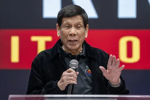 Former President of the Philippines Rodrigo Duterte speaks inside the Southorn Stadium during a thanksgiving gathering organized by Hong Kong-based Filipino workers for the former populist president in Hong Kong on March 9, 2025. (AP Photo/Vernon Yuen, File)