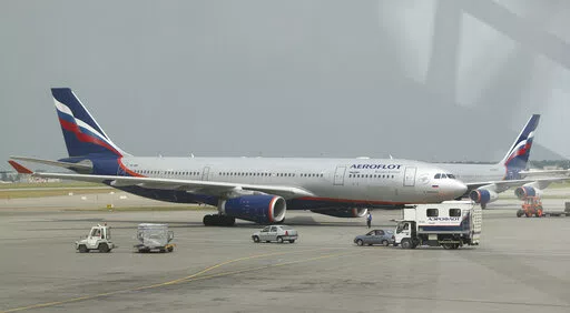The Airbus A330 aircraft used for an Aeroflot international flight is prepared at Sheremetyevo airport in Moscow, on June 27, 2013. Europe and Canada said Sunday, Feb. 27, 2022, they would close their airspace to Russian airlines after Russia’s invasion of Ukraine, raising the pressure on the United States to do the same. (AP Photo/Sergei Grits, File)
