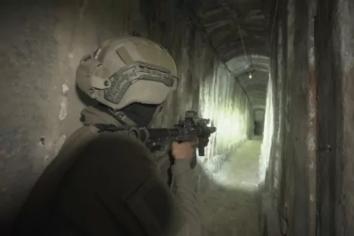 Israeli soldiers show the media an underground tunnel found underneath Shifa Hospital in Gaza City, Nov. 22, 2023. The U.S. is “confident” that Palestinian militant groups used Gaza's largest hospital to hold “at least a few” hostages seized during their bloody Oct. 7 attack and to house command infrastructure, an American intelligence assessment declassified Tuesday, Jan. 2, 2024, and shared by a U.S. official found. (AP Photo/Victor R. Caivano, File)