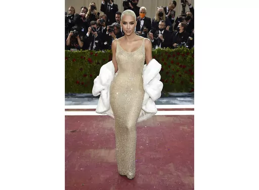 Kim Kardashian wears the iconic dress worn by Marilyn Monroe at The Metropolitan Museum of Art's Costume Institute benefit gala in New York on May 2, 2022.  Some Monroe enthusiasts believe the dress was damaged after Kardashian wore it but the Ripley’s Believe It or Not! attraction in Hollywood, Calif., where the garment is on display, denies that claim. (Photo by Evan Agostini/Invision/AP, File)