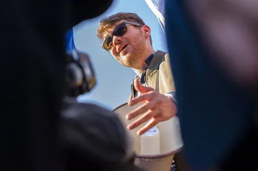 Nick Fuentes, right-wing podcaster, speaks at a pro-Trump march, Nov. 14, 2020, in Washington. A surge of anti-Jewish vitriol, spread by a world-famous rapper, an NBA star and other prominent people, including Fuentes, is stoking fears that public figures are normalizing hate and ramping up the risk of violence in a country already experiencing a sharp increase in antisemitism. (AP Photo/Jacquelyn Martin, File)