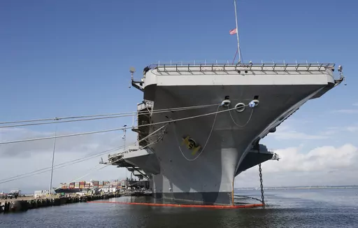 The nuclear aircraft carrier USS George Washington pier side at Norfolk Naval Station in Norfolk, Va., Sept. 30, 2016. A Navy investigation triggered by a series of suicides is recommending widespread improvements in housing, food, parking and internet for sailors, as well as changes to mental health and other personnel programs. The investigation began last year after seven service members assigned to the aircraft carrier USS George Washington died over a 12-month period ending April 2022, incl