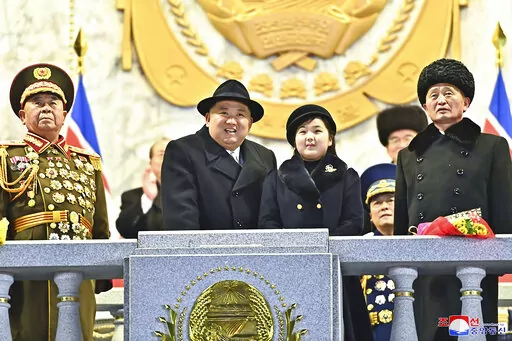 In this photo provided by the North Korean government, North Korean leader Kim Jong Un, center left, with his daughter attends a military parade to mark the 75th founding anniversary of the Korean People’s Army on Kim Il Sung Square in Pyongyang, North Korea Wednesday, Feb. 8, 2023. Independent journalists were not given access to cover the event depicted in this image distributed by the North Korean government. The content of this image is as provided and cannot be independently verified. Kor