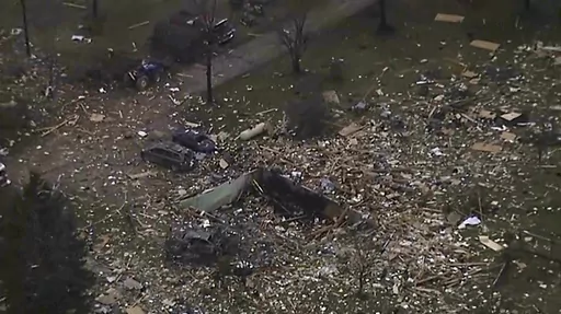 This image from video shows the remains of a house scattered after an explosion in Northfield Township, Mich., on Saturday Dec. 30, 2023. Several were killed and injured. (WXYZ via AP)