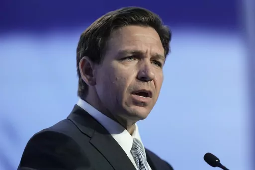 Republican presidential candidate Florida Gov. Ron DeSantis speaks at the Moms for Liberty meeting in Philadelphia, Friday, June 30, 2023. A prominent conservative group is slamming a video shared by Ron DeSantis' presidential campaign attacking GOP rival Donald Trump's past support for gay and transgender people. The video drew immediate criticism from prominent LGBTQ+ Republicans. (AP Photo/Matt Rourke)