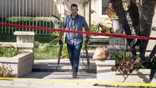 Investigators remove firearms from a house in the 8500 block of E. Canyon Vista Dr. in Anaheim, Calif., on Aug. 4, 2023. A Southern California judge was charged Friday, Aug. 11, 2023, with murder in the shooting death of his wife and 47 weapons were seized from the house, authorities said. Orange County Superior Court Judge Jeffrey Ferguson, 72, was arrested last week after his adult son called 911 to report his mother, Sheryl Ferguson, had been shot at the family's home in the upscale neighborh